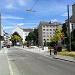 Looking up the street towards building